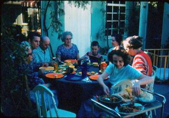 Early pic of family dining on patio